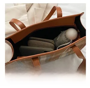 Large capacity tote bag showing spacious interior with wallet, phone, and umbrella