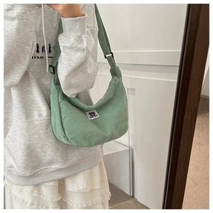 Morandi green corduroy dumpling crossbody bag featuring cute bear patch detail