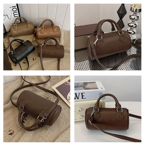 Detail view of four vintage Boston bags showing matte leather texture and silver hardware