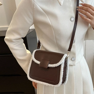 Elegant dark brown crossbody square bag with white fleece trim and slim shoulder strap
