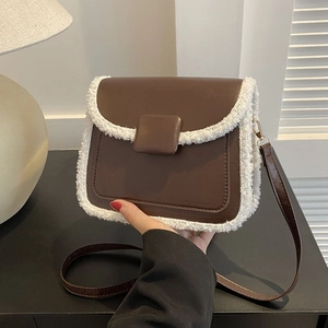 Brown faux leather crossbody square bag with white faux fur trim and adjustable strap