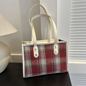 Classic red and white plaid tote bag with faux leather trim and golden rivets details