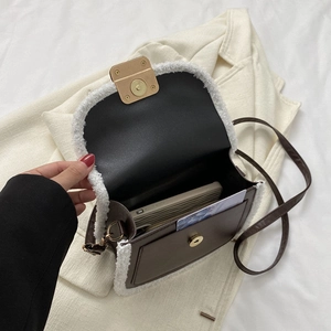 Brown leather crossbody bag with white faux fur trim and gold magnetic closure