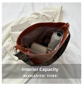 Interior view of brown leather tote showing ample capacity for umbrella and daily essentials