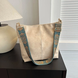 Minimalist beige leather tote bag for women featuring vintage bohemian wide woven strap