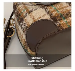 Macro view of stitching details and plaid fabric texture on a bucket bag side