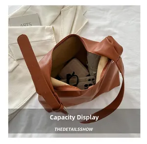 Interior view showing the large capacity of this brown PU leather tote shoulder bag