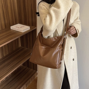 Retro brown large capacity tote bag shown at 45-degree angle in a minimalist setting