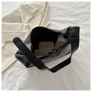 Top view of large black tote bag showing spacious interior with phone and umbrella