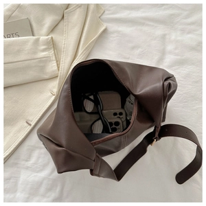 Interior view of large faux leather hobo bag showing spacious storage with zipper closure
