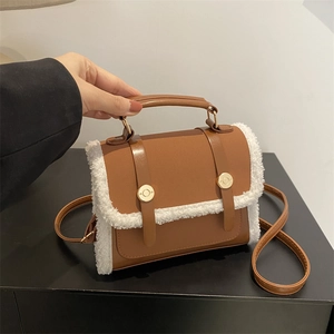 Brown vintage faux leather crossbody bag with white plush trim and golden hardware buckle