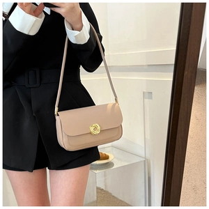 Minimalist beige leather shoulder bag with gold metal clasp for modern women's outfit