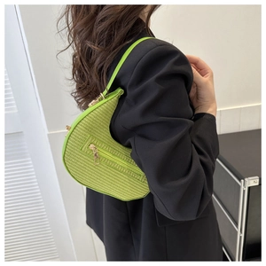 Neon green woven crescent underarm bag featuring decorative zipper and gold-tone hardware