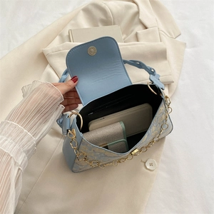 Light blue embroidered silk underarm bag with gold flower chain and interior view