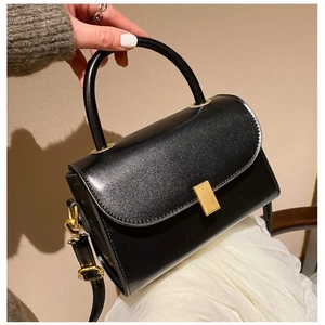 Vintage black crossbody square bag with glitter finish and gold rectangular buckle closure