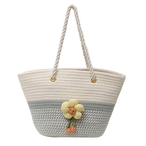 Fashionable woven tote bag with bicolor design and decorative knit flower detail