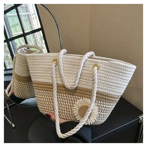 Detailed close-up of woven cotton tote bag featuring a 3D sunflower and thick rope handles