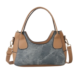 Minimalist two-tone underarm bag with brown leather and grey denim panels for women