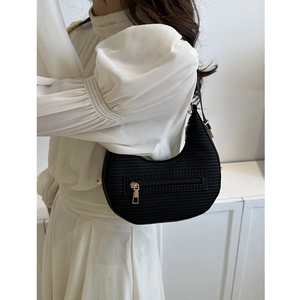 Fashionable black woven crescent hobo bag for women with gold zipper on ivory background