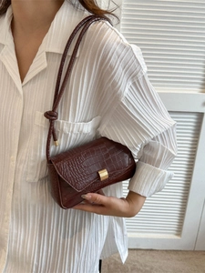 Brown faux crocodile leather shoulder bag with gold clasp and elegant slim strap