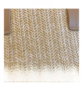 Macro detail of hand-woven straw texture and leather stitching on summer beach bag