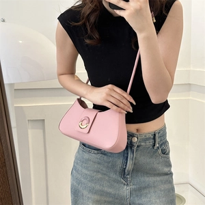 Minimalist light pink faux leather underarm bag with decorative metal buckle and strap