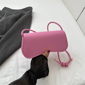 Rose pink faux crocodile leather shoulder bag with gold lettering and slim strap