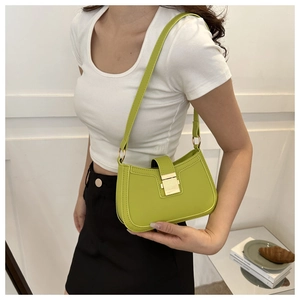 Close-up of bright green PU leather shoulder bag featuring a sleek gold metal buckle