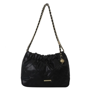 Chic black quilted bucket bag with gold chain strap and elegant spherical pendant detail