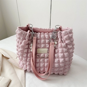 Pink pleated bubble tote bag with pearl and silver chain straps and leather logo tag