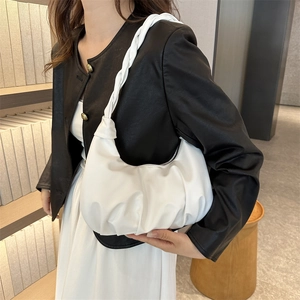 Minimalist white pleated leather dumpling bag with woven strap for daily commuting