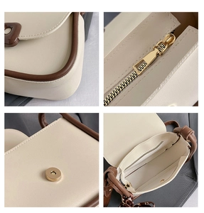 Detailed views of interior compartments and gold metal zipper on minimalist crossbody bag