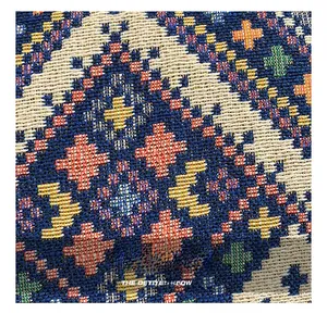 Detailed macro view of ethnic geometric woven fabric on a stylish tote bag