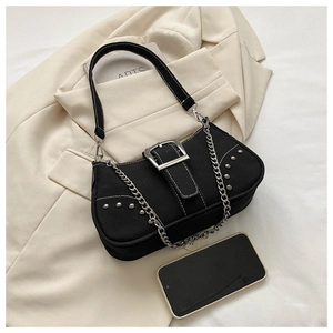 Detail of black canvas shoulder bag with silver hardware, studs and contrast white stitching
