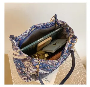 Ethnic retro woven tote bag with geometric patterns showing large interior storage space