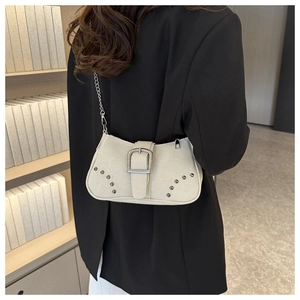 Detail of light gray frosted shoulder bag with silver buckle and metallic chain strap
