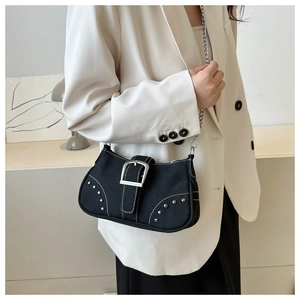 Y2K style black canvas shoulder bag with silver rivets and metal buckle detail