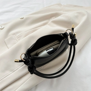 Sac à main chic noir en forme de pois avec doubles poignées nouées et anneaux