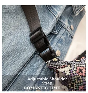 Detail of adjustable shoulder strap and buckle on a woven tote with geometric patterns