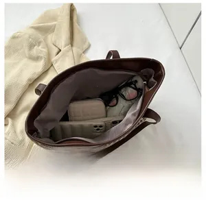 Top view of houndstooth tote interior showing spacious storage for essentials
