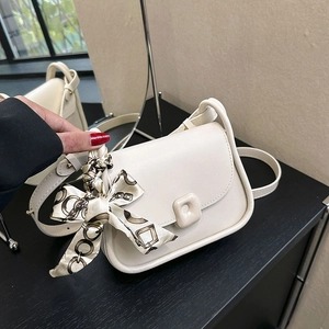 Elegant cream shoulder bag with square buckle and decorative chain-print silk scarf