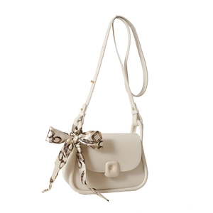 Elegant cream white square crossbody bag with patterned silk scarf handle on white background