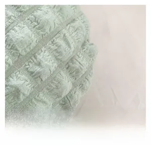 Macro shot of light green cloud pleated fabric with premium 3D bubble texture detail