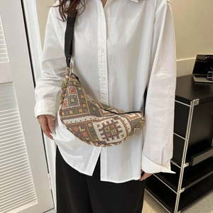 Bohemian style crescent crossbody bag with multi-color geometric jacquard pattern