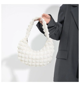 Detail showing white cloud pleat bubble texture on hobo bag for women