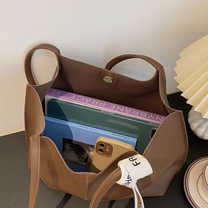 Brown large capacity tote bag with fashion ribbon showing spacious interior for daily essentials