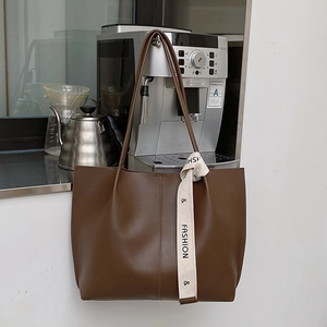 Retro deep brown leather tote bag with stylish ribbon detail for women's daily commute
