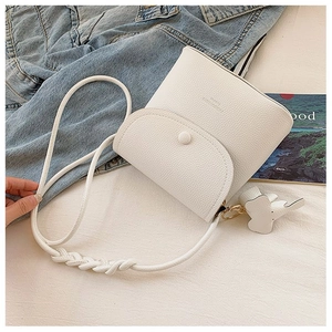 White lychee leather shoulder bag with thick woven rope strap and cute elephant charm