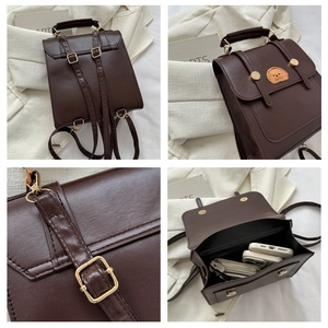 Close-up of brown PU leather backpack with cartoon dog embroidery and golden buckle