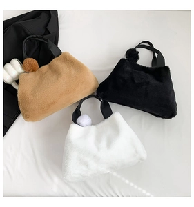 Three plush faux fur bucket bags in brown black and white with soft fuzzy poms